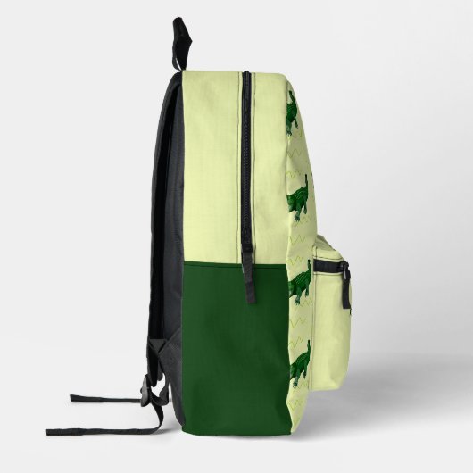 名前をカスタムするグリーンアリゲーターオンイエロー プリントバックパック (左)