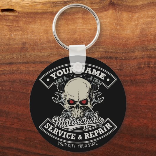 名前をカスタムするバイクもしくは自転車に乗る人整備士スカルオートバイガレージ キーホルダー (正面)