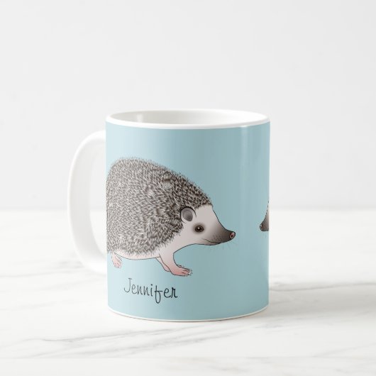 名前を持つアフリカのPygmy Hedgehog漫画デザイン コーヒーマグカップ (正面左)