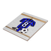 名前入りで黒くおよび青のフットボールのサッカージャージー タイル (側面)