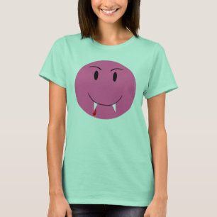 吸血鬼の牙のTシャツが付いているピンクの顔 Tシャツ