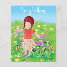 咲く草地に自転車を持つ女の子