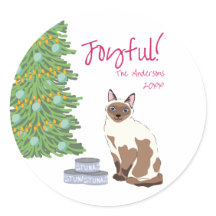 喜びに満ちたクリスマスのシャム猫とマグロ