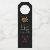 喜びの知らせ赤いクリスマスポインセチアの黒 ボトルネックタグ (裏面)