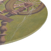 回転するホイールに座ったアイルランドの年配の女性の狂人 カッティングボード (角)