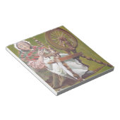 回転するホイールに座ったアイルランドの年配の女性の狂人 ノートパッド (アングル)