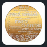 国際的Christmas Navidad Greeting Sシール スクエアシール<br><div class="desc">Wish Christmas in many languages : Feliz Navidad - Feliz Natal - Joyeux Noel - Frehliche Weihnachen - Vrolijk Kerstfeest - Buone Feste Natalizie - God Jul - Merry Christmas，ゴールデンの背景に切り取りスタイル(白レタリング)のような美しいい文字デザインをを付したクリスマス。デザインの白い背景の正方形のステッカー。簡単にサイズを変更できるデザイン。聖降誕祭忘れの挨拶の全国際的集を行うな。</div>