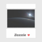 地球の地平線上に沈む太陽。 シール (シート)