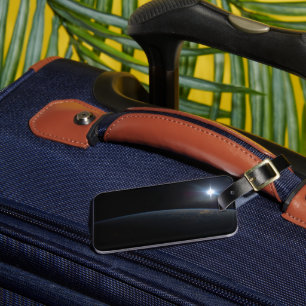 地球の地平線上に沈む太陽。 ラゲッジタグ