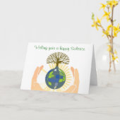 地球を握る手を搭載する夏至の恵み カード (黄色い花)