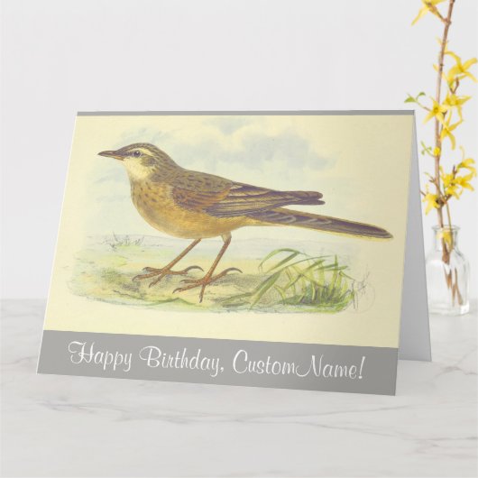 地面に立つ茶色い羽の鳥 カード (黄色い花)