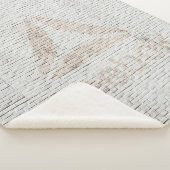 壁に付いたリーボックのロゴの写真を閉じる シェルパブランケット (3/4)