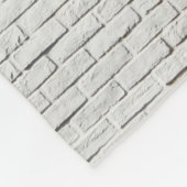 壁に付いたリーボックのロゴの写真を閉じる フリースブランケット (角)