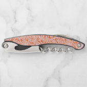 壁のテクスチャのように見える、サーモンカラー ソムリエナイフ (正面)