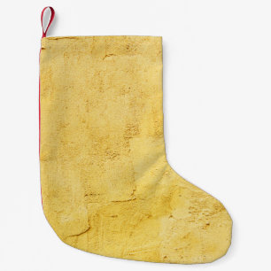 壁の薄い黄色の抽象芸術質感の漆喰 スモールクリスマスストッキング
