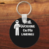 壊れた腕の子供たちが着陸に取り組む キーホルダー (正面)