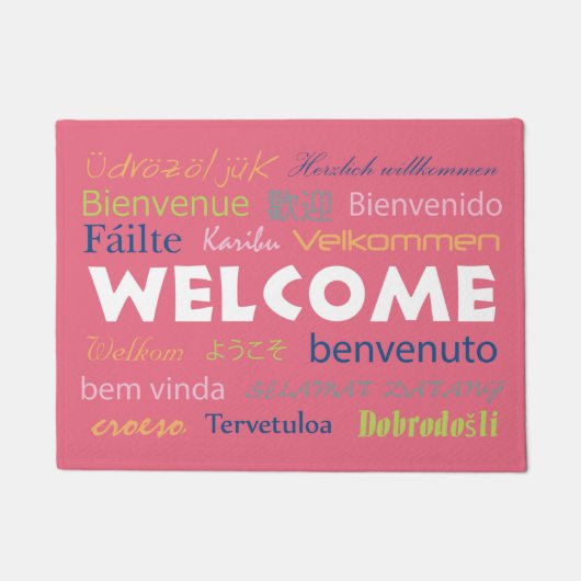 多くの言語でようこそピンクの背景の書式 ドアマット (正面)