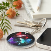 夜白熱［赤熱］光を放つの蝶3匹 キーホルダー (正面右)