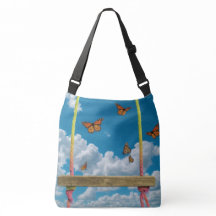 夢のような青空にオレンジ色の蝶