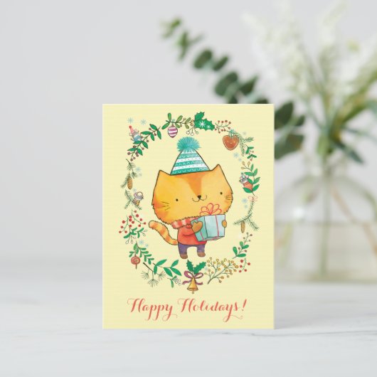 大きいギフト用の箱の郵便はがきを持つかわいいクリスマス猫 シーズンポストカード (スタンド正面)