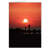 大人と子供の魚釣りが夕暮れ (正面)