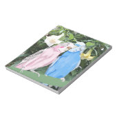 天使トランペットに対するピンクとブルーのブディーズ ノートパッド (回転)