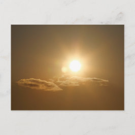 太陽と雲のあるオレンジ色の空 ポストカード