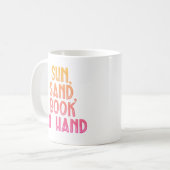 太陽の砂と手に本 コーヒーマグカップ (正面左)