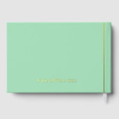 夫婦の名前と成立日付が刻まれたゴールド ゲストブック (裏面)