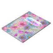 奇妙な活気に満ちたカラフルな水色のフローラル ノートブック (左側)