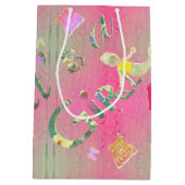 「女の子だ」ピンク図解入りの、写真付きのフローラフォント ミディアムペーパーバッグ (裏面)