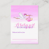 女の赤ちゃんのピンクシャワーの表示カードを持つこうのとり エンクロージャーカード (正面)