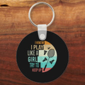 女の遊子がBadminを上げ保る キーホルダー (正面)