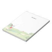 女子ゴルファーがコースでゴルフをしている ノートパッド (回転)