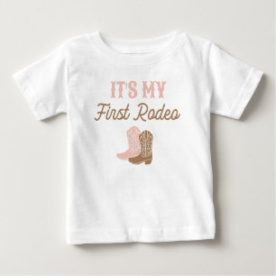 女性のカーボーイファーストロデオ誕生日 ベビーTシャツ