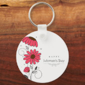 女性の日と円描を描いたピンクの花 キーホルダー (正面)