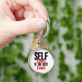 女性エンパワーメントTシャツ – Self Love Is 最高の キーホルダー (手)
