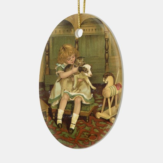子ネコのオーナメントを握っている美しい子供 セラミックオーナメント (左)