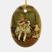 子ネコのオーナメントを握っている美しい子供 セラミックオーナメント (正面)