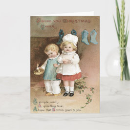 子供のストッキングのヒイラギの蝋燭 シーズンカード