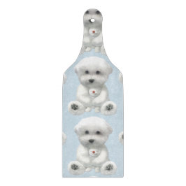 子犬がおもちゃを抱きしめている カッティングボード