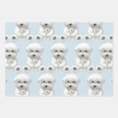 子犬がおもちゃを抱きしめている ラッピングペーパーシート (正面)