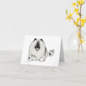 子犬を持つKeeshond カード (黄色い花)