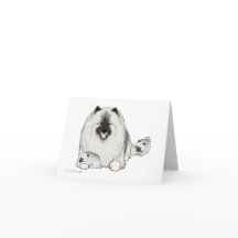 子犬を持つKeeshond