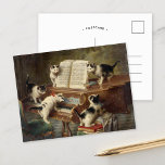子猫の話 | カール・ライチェルト ポストカード<br><div class="desc">子猫のリサイタル（1908年） | カール・ライチェルトの『子猫のリサイタル』は魅力的、5匹の可愛らしい子猫がピアノを集め絵を描て、リサイタルを演奏しているよのまわりにうで想像力に富んだリサイタル。それぞれの子ユニーク猫のポーズと表情がシーンに個性を持ちよくはしゃぐ込み、ピアノと居心地の良い描写インテリアが深さと温かさを与える。詳細や語り話に対するReichertの例外的な注目お洒落は、この絵を描動物の世界における好奇心と創造性の楽しいお祝いを作り出す。デザインツールを使用してイメージのカスタム文字を追加したり、イメージをカスタマイズする。</div>