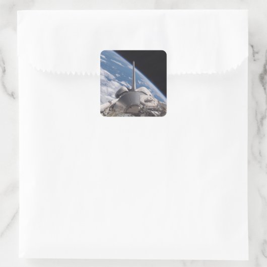 宇宙シャトルディスカバリーが地球に後退 スクエアシール (バッグ)