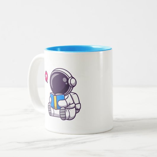 宇宙飛行士読の本かわいい子供 ツートーンマグカップ (正面左)