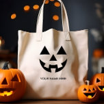安いハロウィーンのカボチャのちょうちんカボチャ顔名前をカスタムする トートバッグ<br><div class="desc">祝は私たちのパンプキン顔バッグとスタイルでハロウィン独占的、あなたのスタイルと一致させることができる多用途のカスタマイズアクセサリーユニーク。あなたの名前またはカスタムメッセージを追加して本当にあなたの名前にする。このバッグは、お洒落ハロウィーンの不気味な側面とおもしろいの側面をシームレスに融合するカボチャデザインを備えている。あなたはトリックやトリートメント、コスチュームパーティーへの参加など、お菓子を集めたり、ハロウィーンのお祝いに個人的なtouchを追加したりするのにしゃれているは、完璧な仲間である。</div>