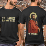 宗教聖ヤコブ使徒カトリック Tシャツ<br><div class="desc">文字「セントジェームズは背中を持っている」が前面にある。背には使徒の聖伝統的ヤコブのカトリックのイメージがある。</div>