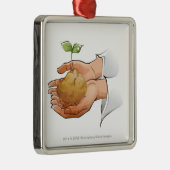 実生植物を握る人の手のクローズアップ メタルオーナメント (右)